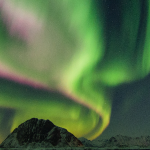 Greenish-yellow aurora with some purple.